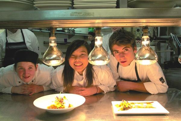L-R Alice Ward, Haruka Arai, and Cassey Strachan practice their dishes ahead of finale dinner at Crowne Plaza Queenstown.